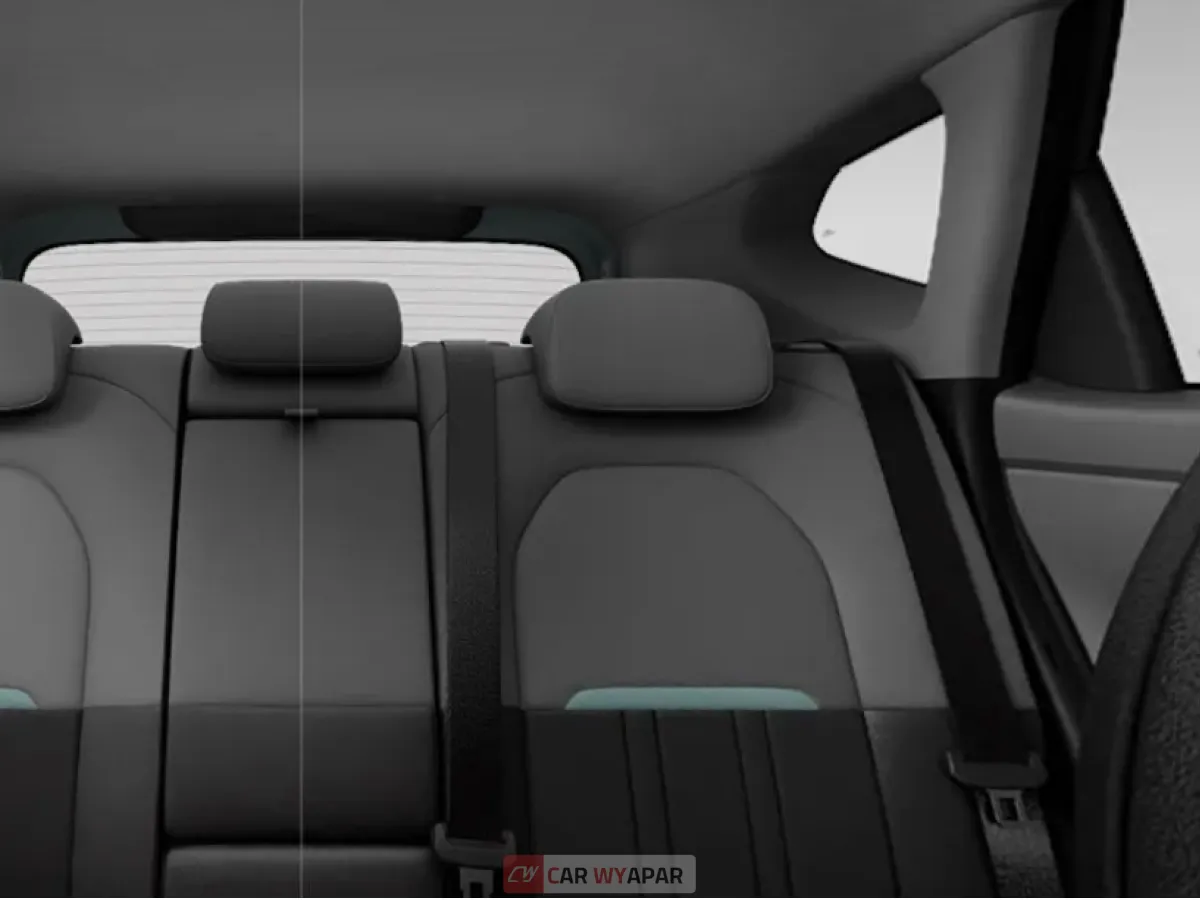 Interior view of the rear bench seats of a Kia Seltos HTX (O) variant, showing black upholstery with adjustable headrests.